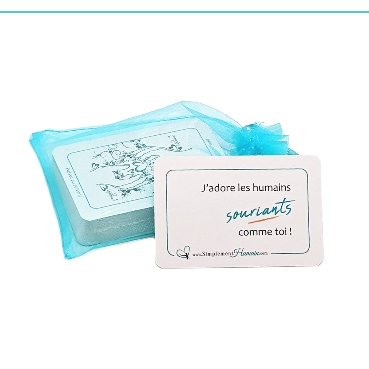 Cartes Passez au suivant avec le message 'J’adore les humains souriants comme toi', posées avec un sac bleu translucide.